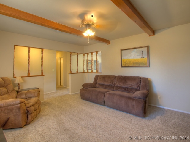 carpeted living room featuring beamed ceiling and ceiling fan