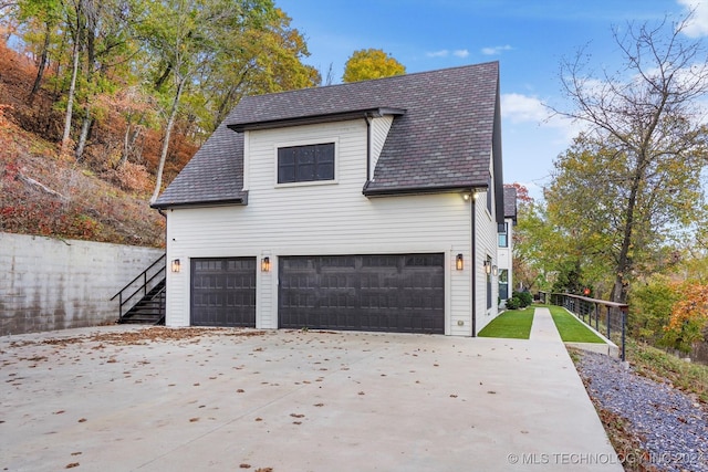 view of side of home with a garage