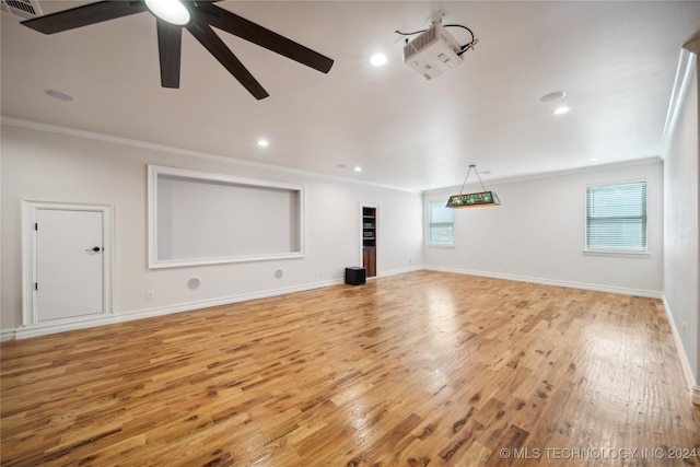 unfurnished living room featuring ceiling fan, ornamental molding, and light hardwood / wood-style flooring