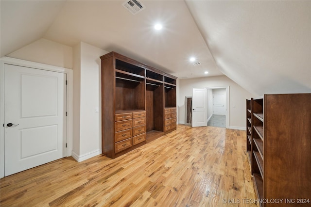 interior space featuring vaulted ceiling and hardwood / wood-style floors