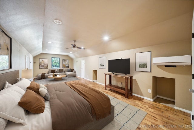 bedroom featuring vaulted ceiling, ceiling fan, and light hardwood / wood-style flooring