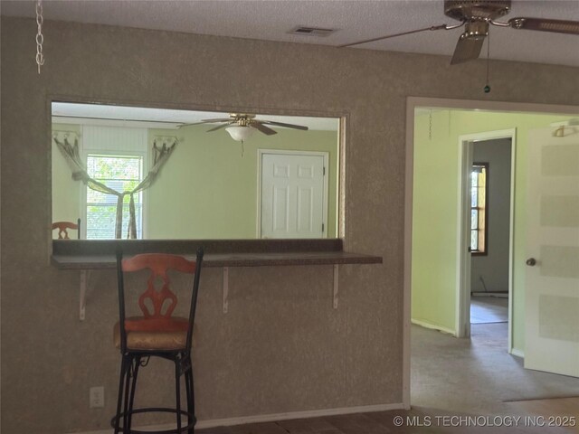 26385 State Highway 1 E, Allen, OK 74825 - interior space with a ceiling fan, a textured ceiling, and baseboards
