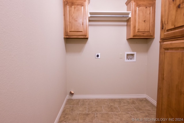 clothes washing area with electric dryer hookup, cabinets, and hookup for a washing machine