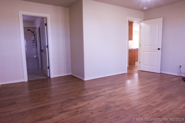 spare room featuring dark hardwood / wood-style flooring