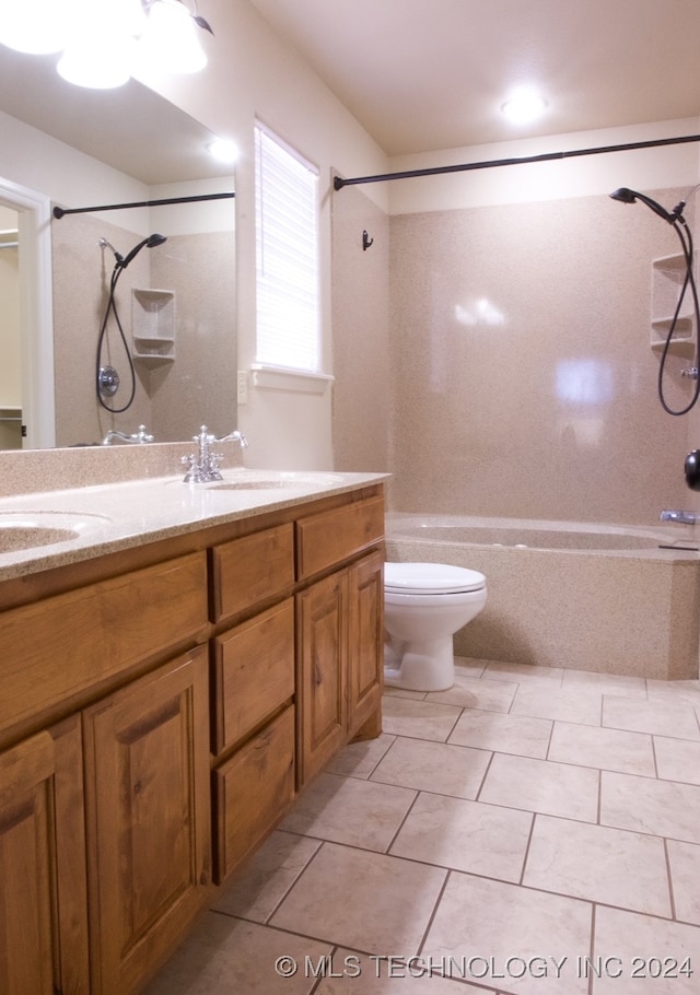 full bathroom with tile patterned flooring, vanity, toilet, and tiled shower / bath