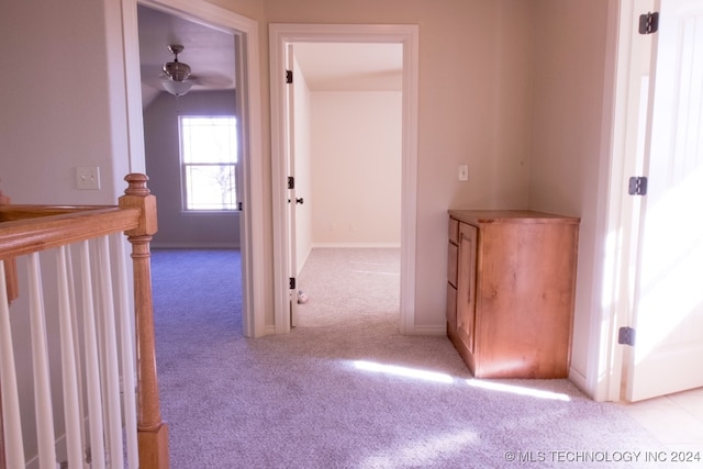 corridor with light carpet