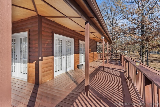 wooden deck featuring french doors