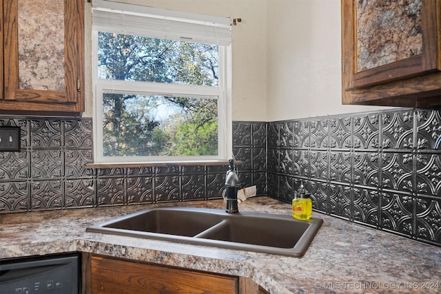 kitchen featuring black dishwasher and sink