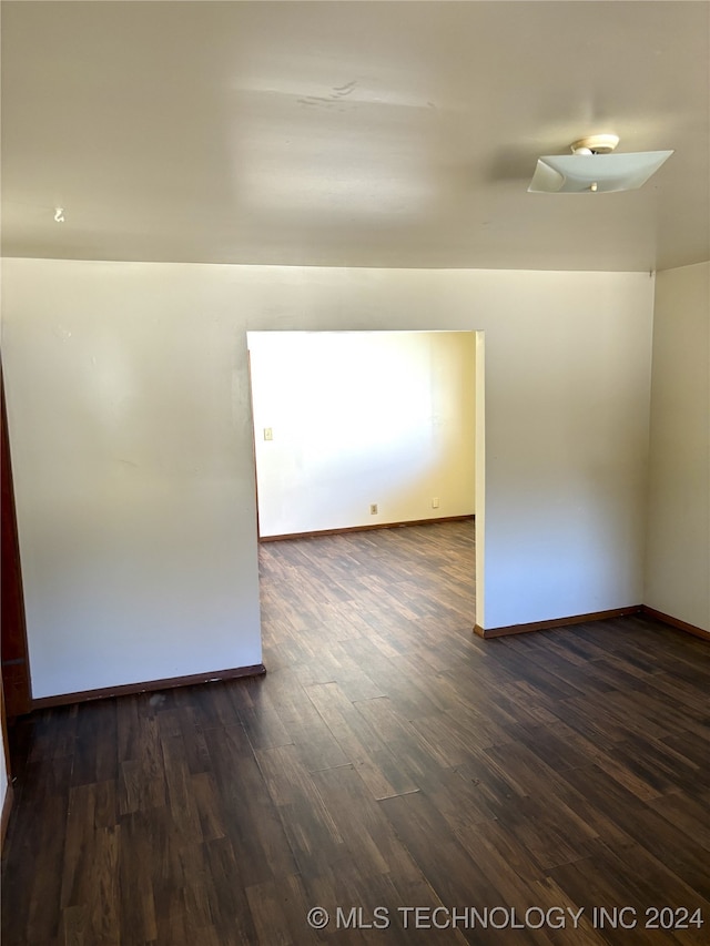 empty room featuring dark hardwood / wood-style floors