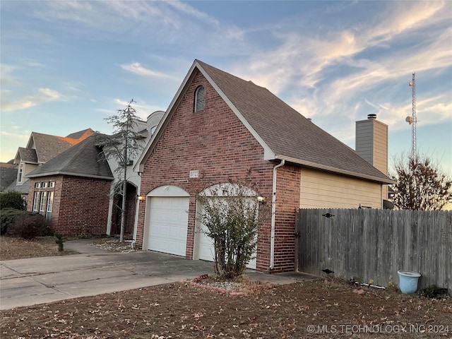 view of property exterior with a garage