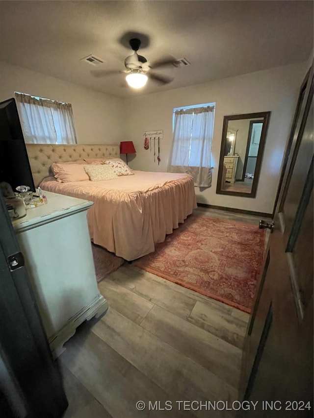 bedroom featuring hardwood / wood-style floors and ceiling fan