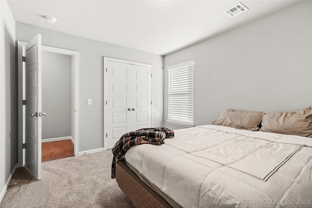 bedroom with a closet and carpet