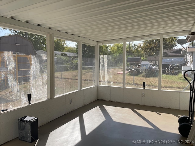 unfurnished sunroom featuring a healthy amount of sunlight