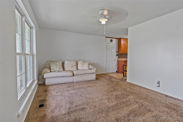 47 S 204th E Ave, Tulsa, OK 74108 - living area with ceiling fan and light carpet