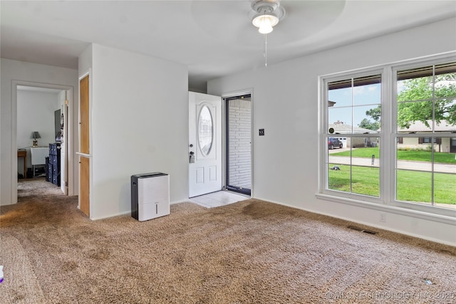 47 S 204th E Ave, Tulsa, OK 74108 - foyer entrance featuring ceiling fan, carpet flooring, and healthy amount of natural light