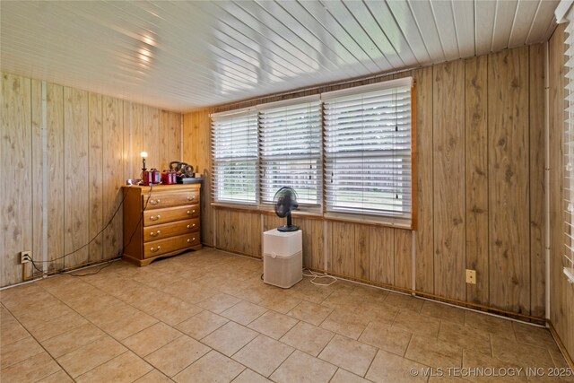 47 S 204th E Ave, Tulsa, OK 74108 - spare room with wooden walls and light tile patterned floors