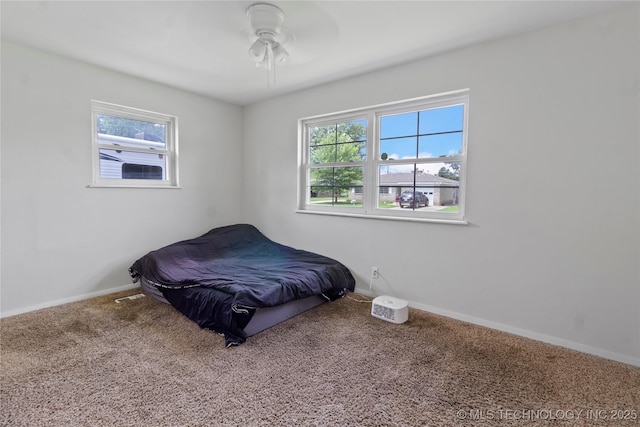 47 S 204th E Ave, Tulsa, OK 74108 - carpeted bedroom featuring baseboards and ceiling fan