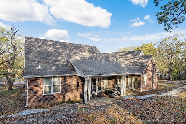 back of property with a patio