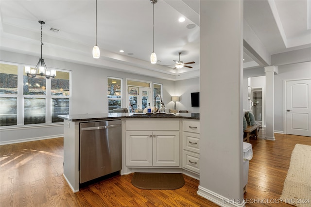 kitchen with white cabinetry, dishwasher, sink, dark hardwood / wood-style flooring, and pendant lighting