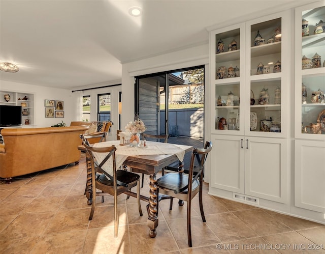 dining room featuring light tile patterned flooring