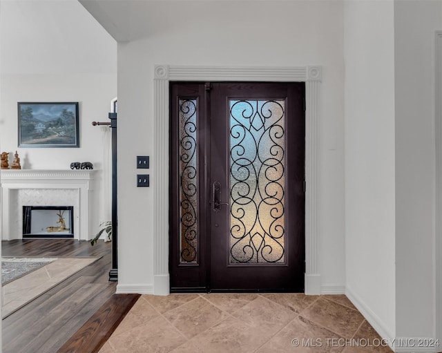 entryway featuring a fireplace