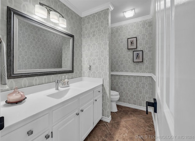 bathroom with toilet, crown molding, and vanity