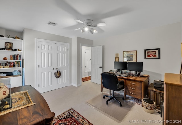 office with ceiling fan and light carpet