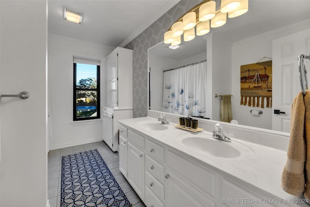 bathroom with crown molding, tile patterned floors, and vanity