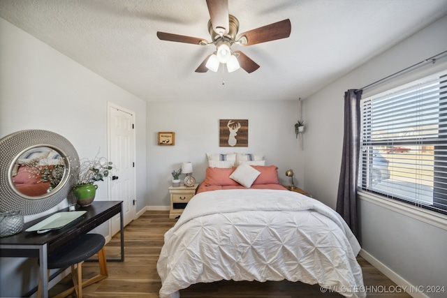 bedroom featuring ceiling fan and hardwood / wood-style flooring