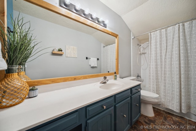 bathroom featuring toilet, a textured ceiling, curtained shower, vanity, and vaulted ceiling