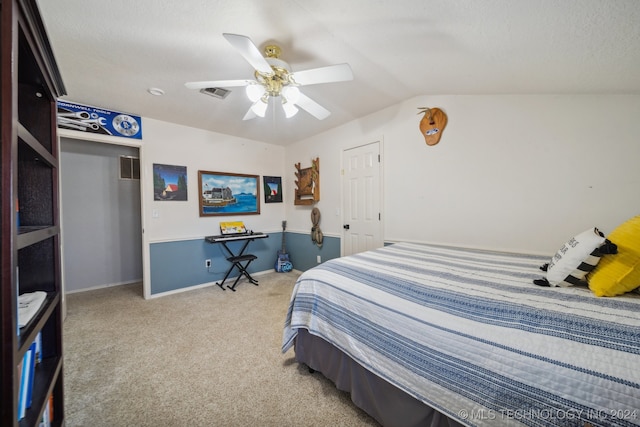 bedroom featuring ceiling fan, light colored carpet, and vaulted ceiling