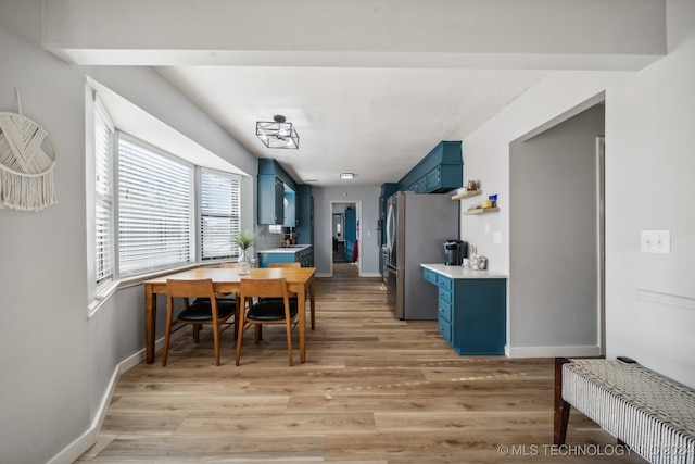 dining area with light wood-type flooring