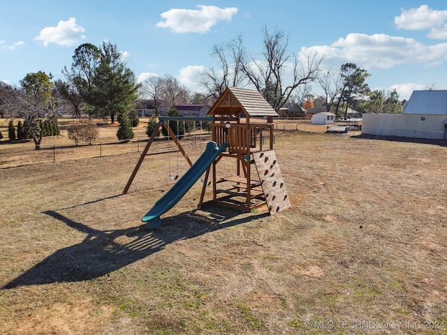 view of jungle gym with a lawn