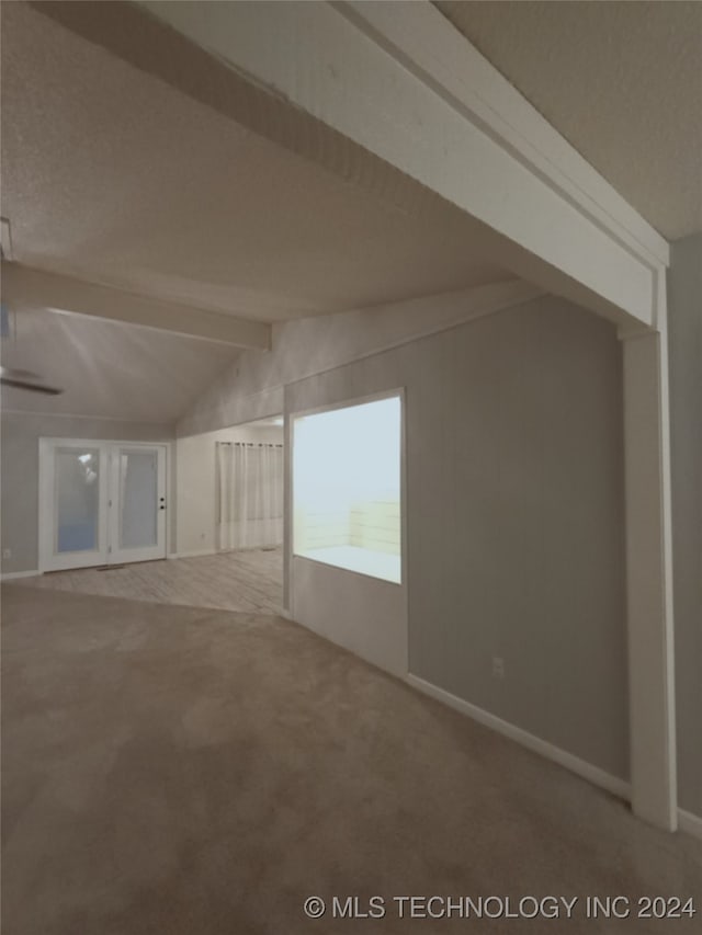 bonus room with carpet flooring and lofted ceiling with beams