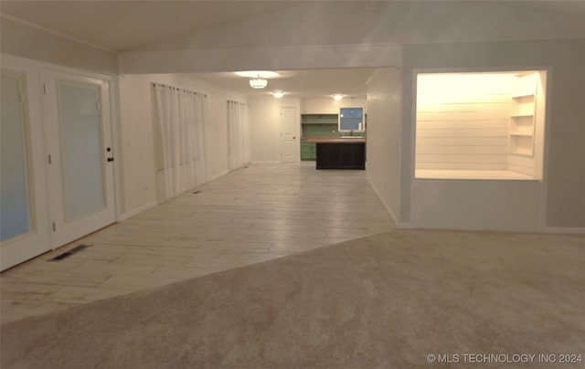 unfurnished room featuring hardwood / wood-style flooring and sink