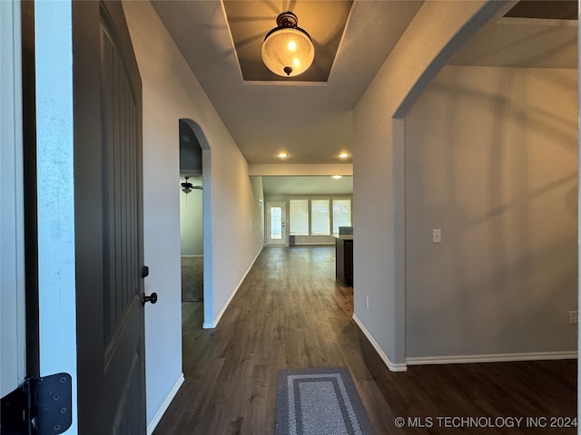 hall with dark hardwood / wood-style floors