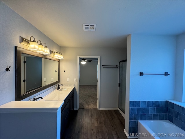 bathroom with vanity, ceiling fan, wood-type flooring, and independent shower and bath