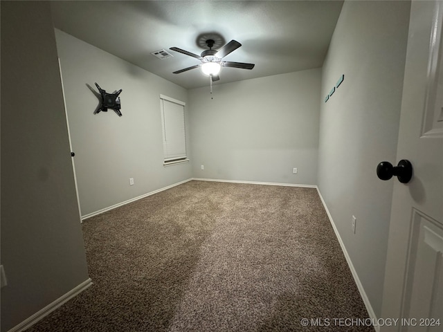 spare room with carpet flooring and ceiling fan