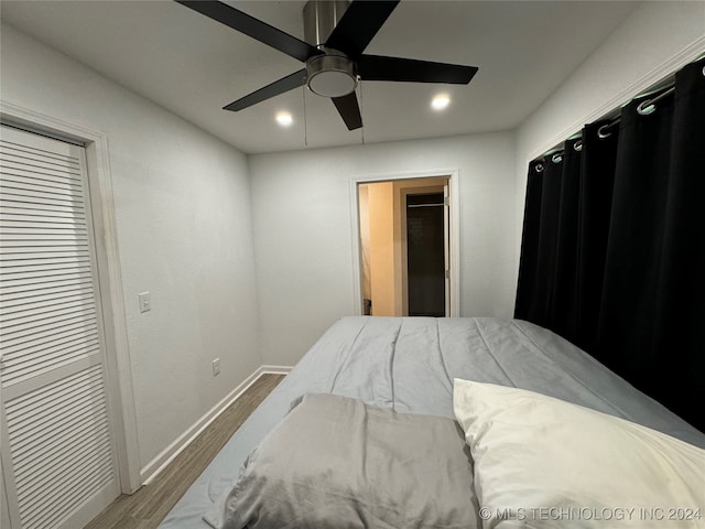 bedroom featuring hardwood / wood-style flooring and ceiling fan