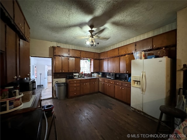 kitchen featuring a textured ceiling, ceiling fan, white fridge with ice dispenser, and dark hardwood / wood-style floors