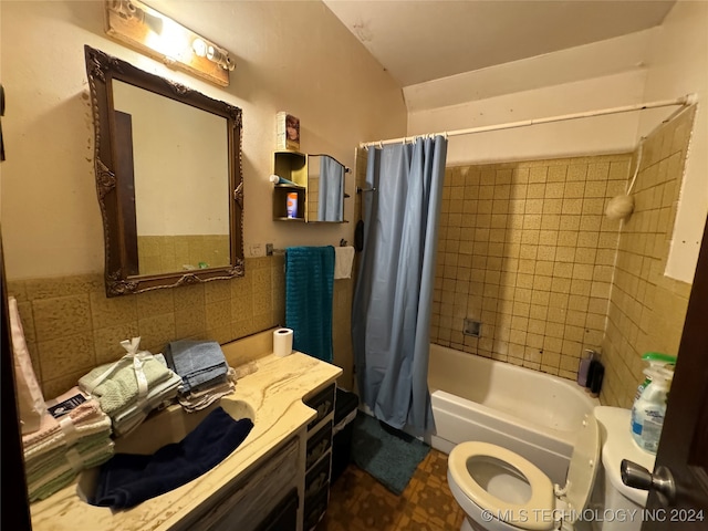 full bathroom featuring shower / bath combination with curtain, toilet, decorative backsplash, vanity, and tile walls