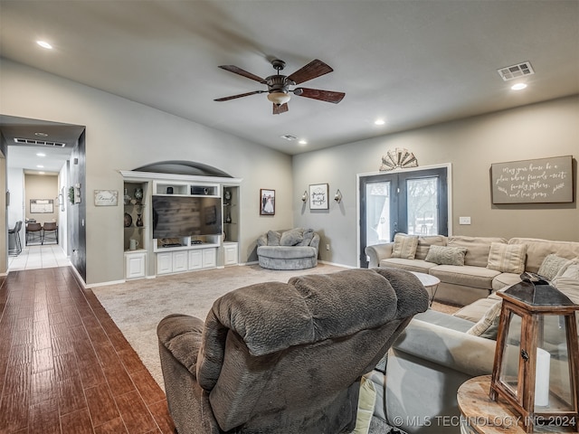 living room featuring ceiling fan, light hardwood / wood-style floors, and french doors