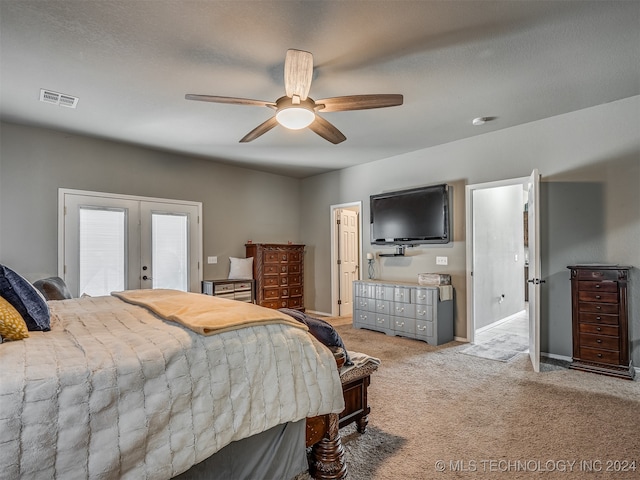 carpeted bedroom featuring ceiling fan and french doors