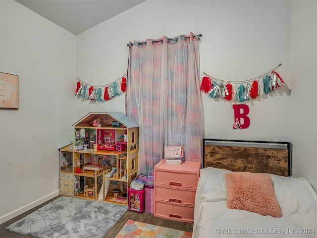 bedroom featuring dark hardwood / wood-style flooring