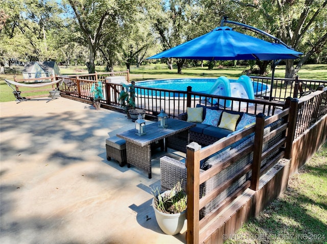 exterior space with an outdoor living space and a patio area