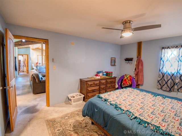 bedroom featuring ceiling fan and light colored carpet