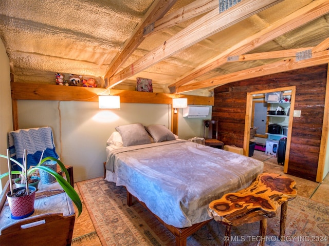 bedroom with a wall mounted air conditioner and vaulted ceiling with beams