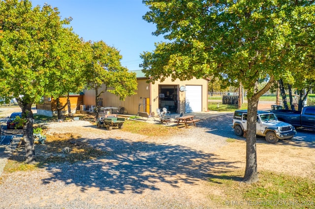 view of front of house with an outbuilding and a garage