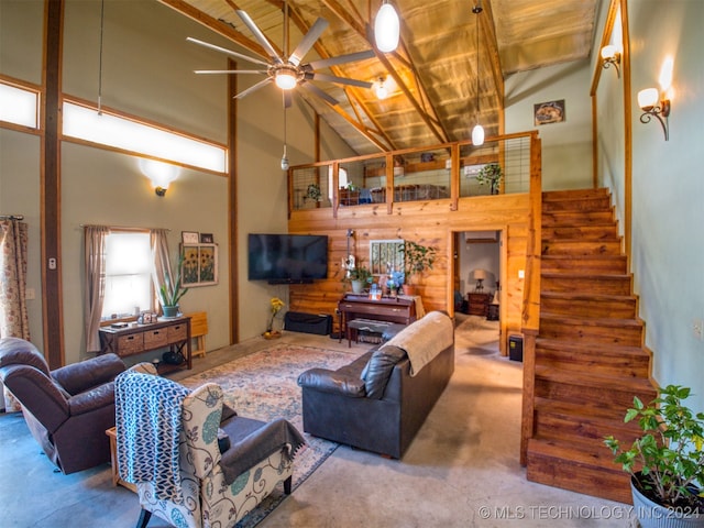 carpeted living room featuring ceiling fan, beam ceiling, wood ceiling, and high vaulted ceiling