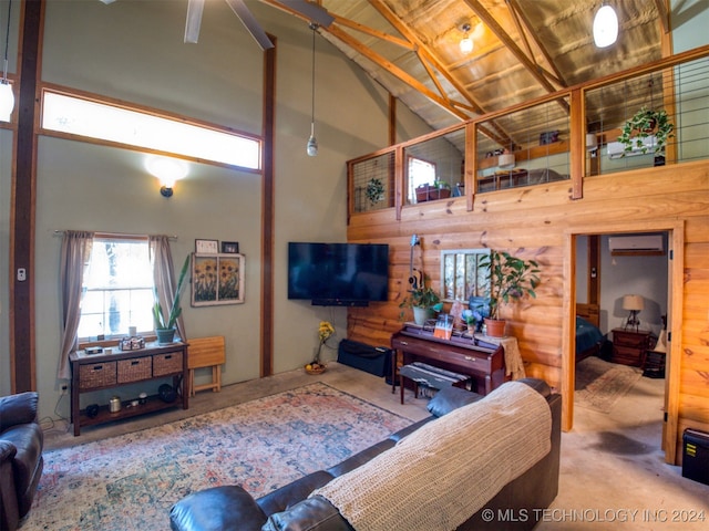 carpeted living room featuring a wall unit AC, high vaulted ceiling, and wood ceiling